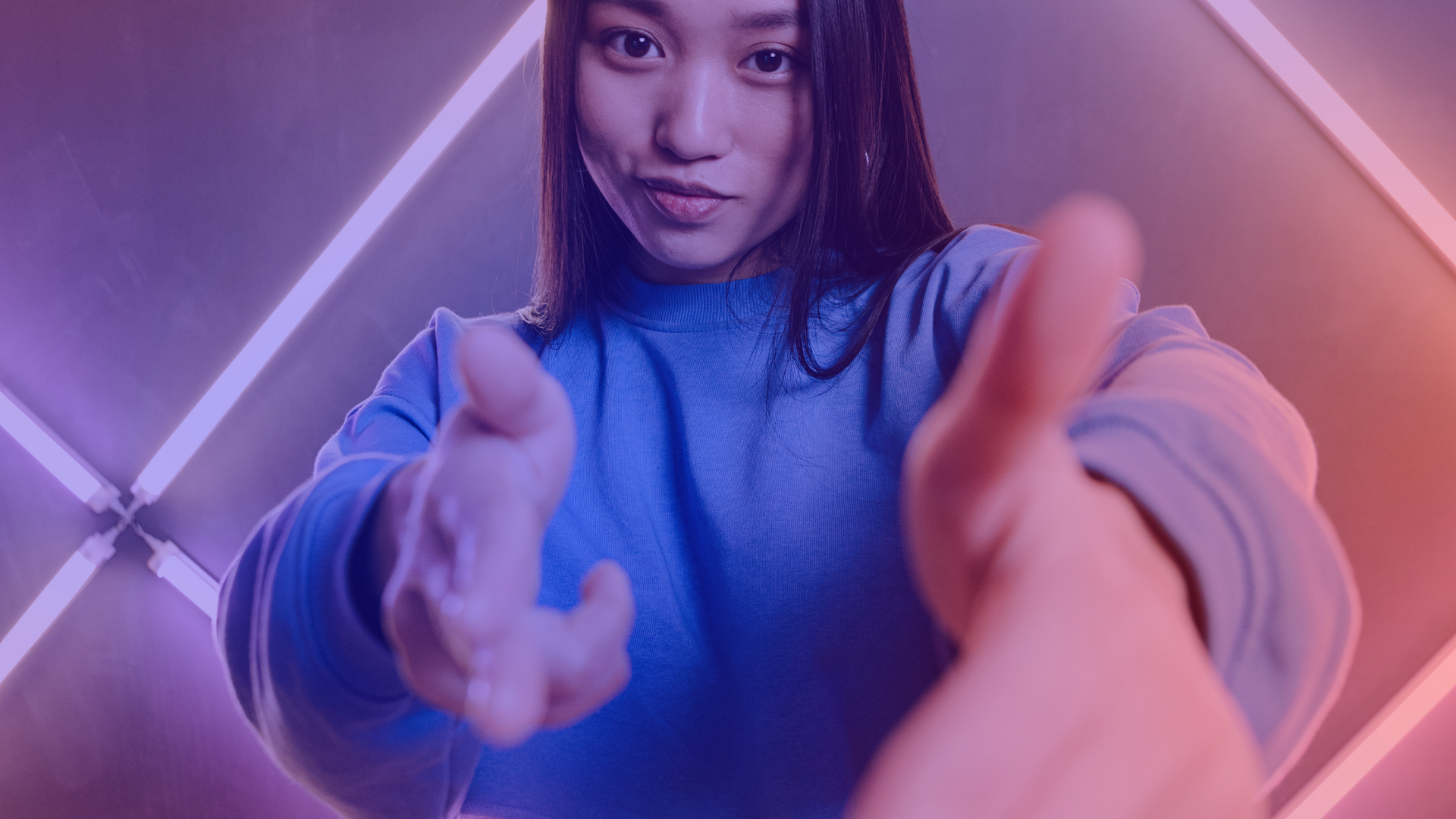 A young woman looks optimistically into the camera