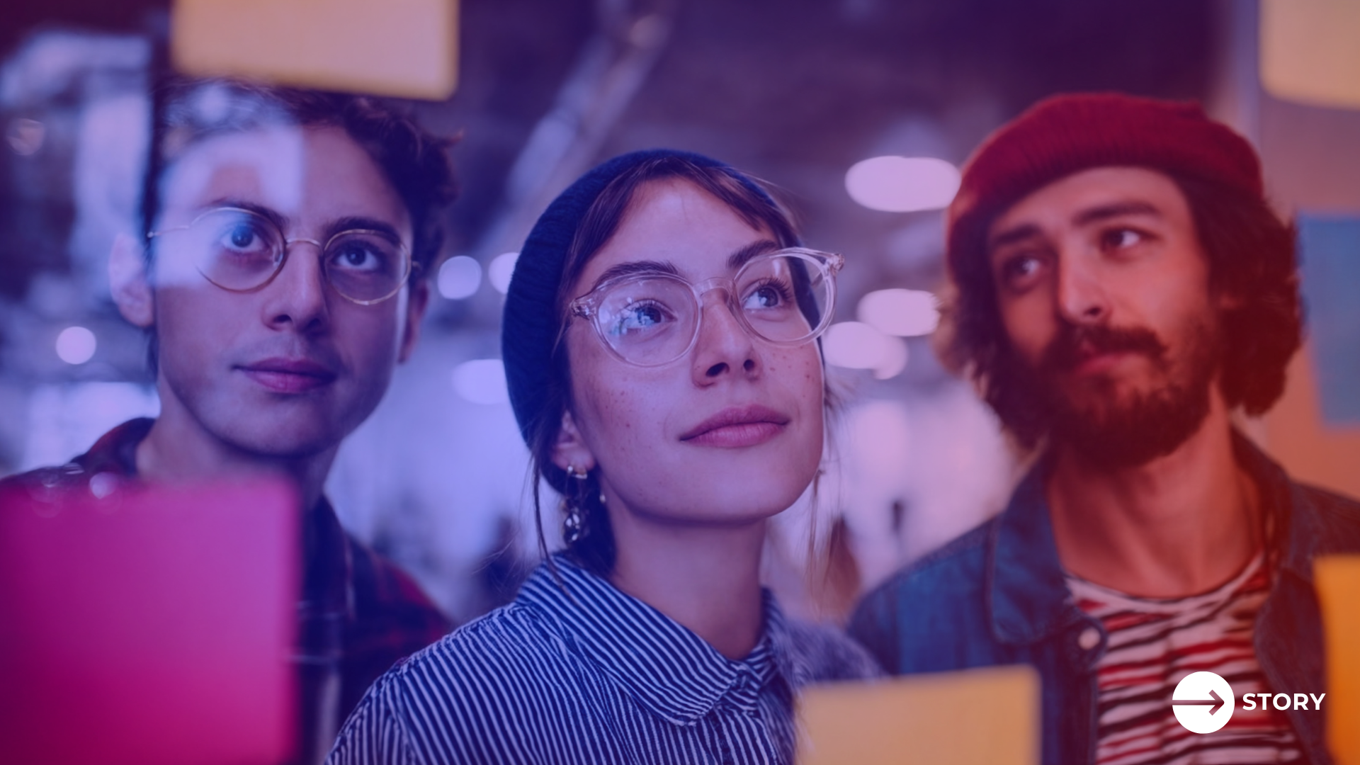 Young marketers review marketing KPIs on a concept board. 